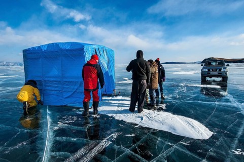 Group of scuba divers before a dive under ice, Lake Baikal, Olkhon Island, Pribaikalsky National