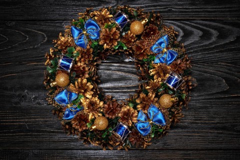 Christmas wreath on dark wooden background