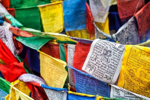 Tibetan Buddhism prayer flags (lungta) with Om Mani Padme Hum Buddhist mantra prayer. Leh, Ladakh,