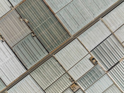 Masses of shimmering plastic greenhouses near El Ejido, aerial view, drone shot, Almería province,