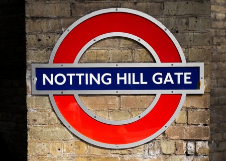 Sign on brick wall, Notting Hill Gate underground station, SLondon, England, Great Britain