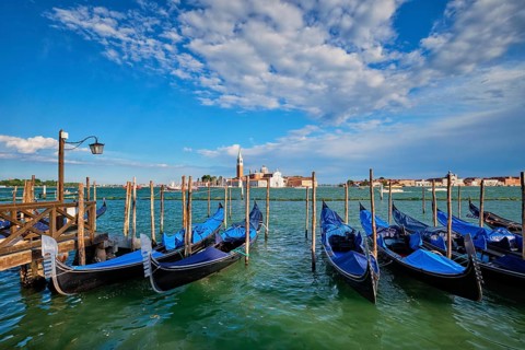 Gondolas and in lagoon of Venice by Saint Mark (San Marco) square with San Giorgio di Maggiore