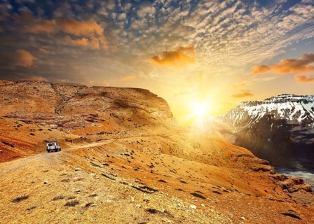 Road in mountains (Himalayas) with car. Spiti Valley, Himachal Pradesh, India, Asia
