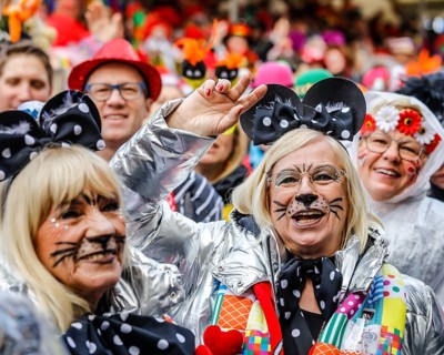 Colourfully costumed carnivalists celebrate carnival in Cologne, on Weiberfastnacht the street