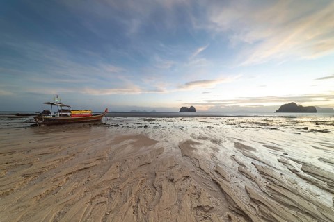 Structures in the sand, sunrise at low tide on the beach of Koh Ngai Island, Andaman Sea, Satun