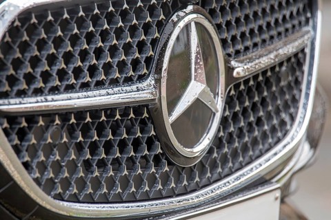 Close-up of the Mercedes star on the radiator grille