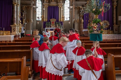 Altar servers preparing for the palm tree procession, tradition since the 18th century, Parish