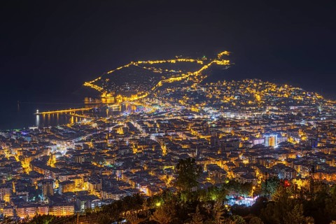 The lights of the city of Alanya on the Turkish Riviera glow in the evening, Alanya, Antalya,