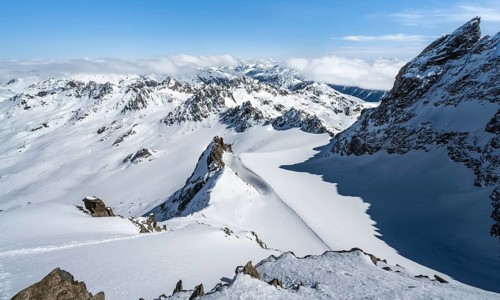 Mountain ridge of Piz Kesch, ascent on Piz Kesch or Piz d'Es-cha in winter, spectacular mountain