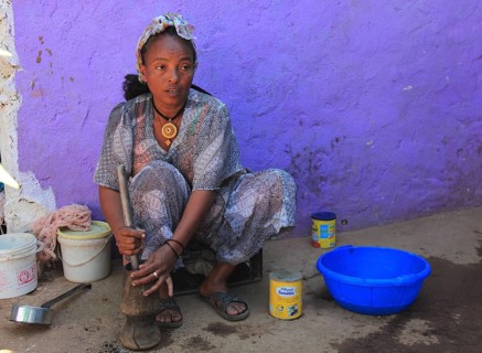 In the highlands of Abyssinia, in the village of Sina, young woman prepares coffee for the coffee