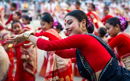 Participants with instructors dance on the final day of a Bihu dance workshop ahead of Rongali Bihu