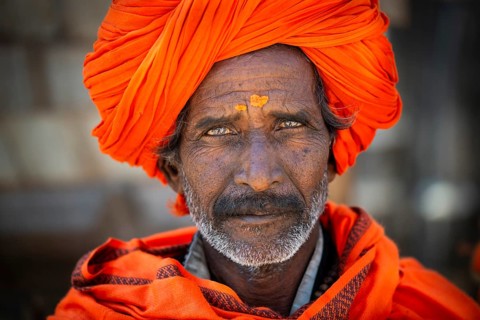 Man with orange turban and yellow bindi on his forehead, portrait, Chittorgarh Fort, Chittorgarh,