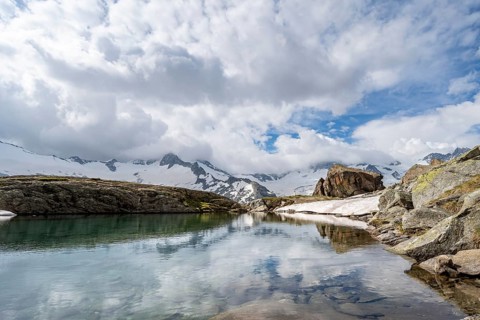 Mountains and glaciers reflected in the Schwarzsee lake, Schwarzensteinkees and Hornkees glaciers,