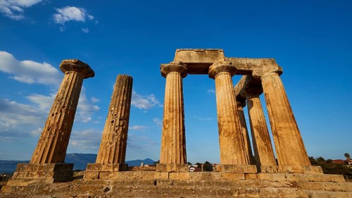 Archaic Temple of Apollo, Doric columns, Ancient Greek ruins with columns and blue sky,