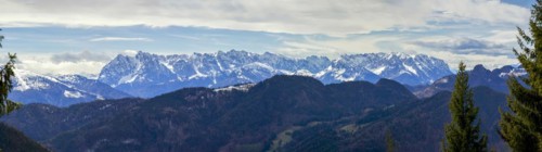 Panoramic view of the snow-covered Alps photographed from the Hochgern summit, at Lake Chiemsee in