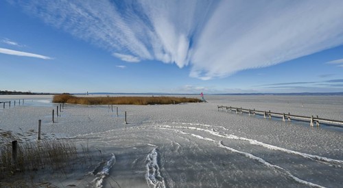 Frozen lake with ice in winter, Lake Neusiedl, Podersdorf am See, Burgenland, Austria, Europe