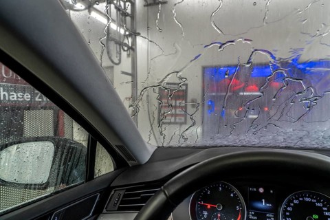 Car in an automatic car wash, car wash tunnel
