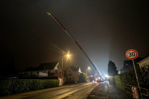 Transport of a 68 metre long, 22 tonne blade of a wind turbine, here in Breckerfeld, with a