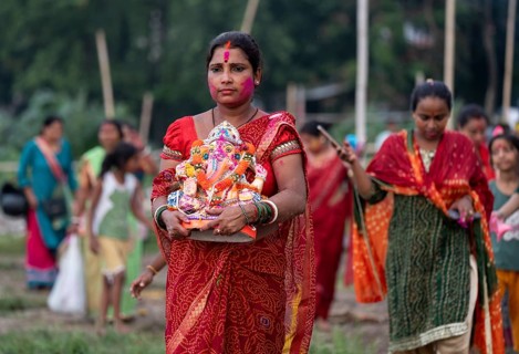 Devotees carries the Ganesha idol to immerse in the Brahmaputra river, during Ganesh Chaturthi