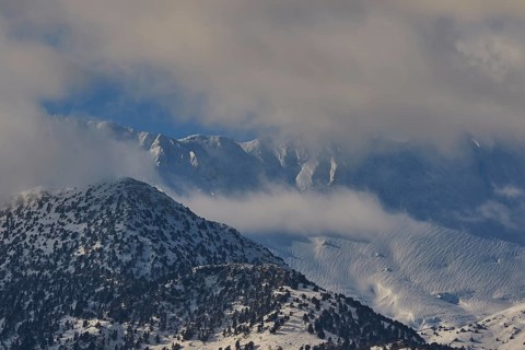 Snow-covered mountain peaks under a slightly cloudy sky, Lefka Ori, White Mountains, mountain