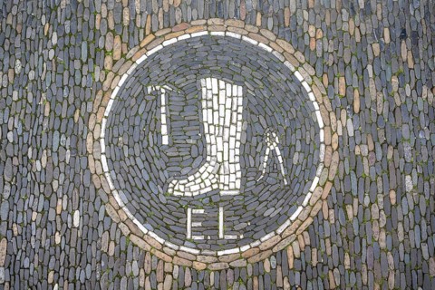 Guild coat of arms of a shoemaker as a floor mosaic in the historic centre of Freiburg, Freiburg im