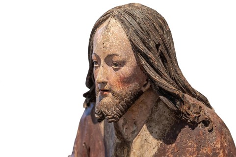 Head of Christ, detail of the Palmesel, wooden figure around 1520, on a white background, Diözesan