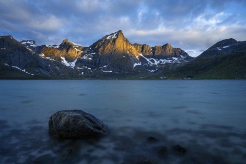 Landscape with sea and mountains on the Lofoten Islands, view over the fjord Flakstadpollen to the