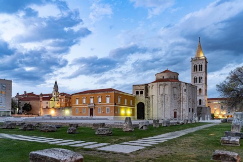 The Church of St Donatus, remains of the Roman forum and the bell tower of Zadar Cathedral at dusk,