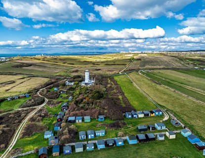 Portland Bird Observatory from a drone, Bill Lighthouse, Portland Bill, Isle of Portland, Dorset,
