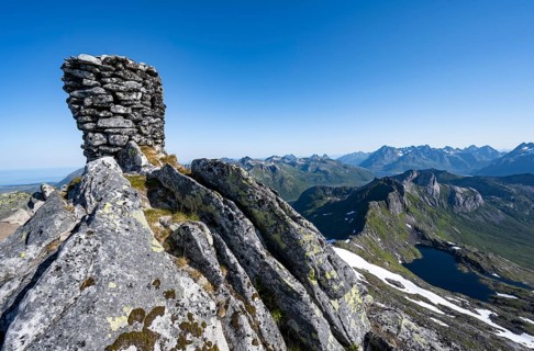 Cairn at the summit of Rundfjellet, view of mountains and fjord landscape, Svolvaer, Nordland,