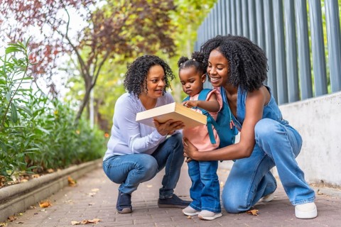 African female family of two generations having fun at the end of a school day