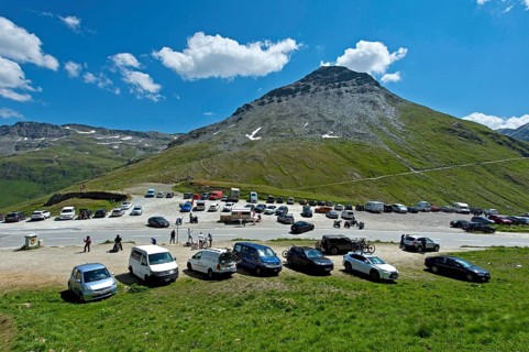 Car park with cars at the top of the Furka Pass, Goms, Valais, Switzerland, Europe