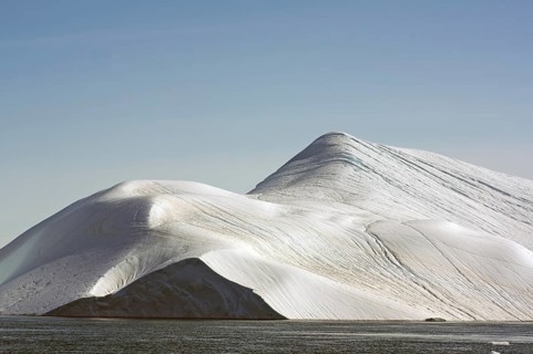 Giant iceberg in the glow of the midnight sun Disko Bay, Ilulissat, Arctic, Greenland, Denmark,