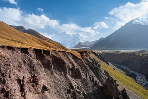 Achik Tash valley between high mountains, mountain landscape with glaciated peak Pik Lenin, Trans