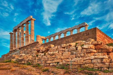 Greece Cape Sounio. Ruins of an ancient temple of Poseidon, Greek god of the sea, on sunset. Shot