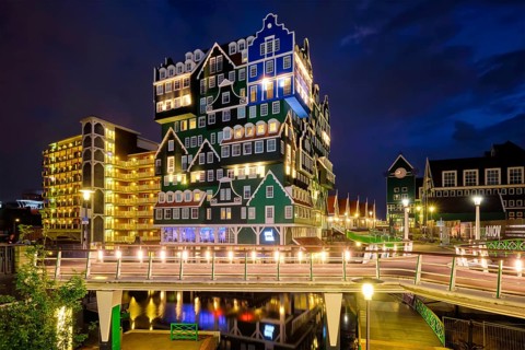 ZAANDAM, NETHERLANDS, MAY 21, 2018: Inntel Hotel in Zaandam illuminated at night. Design of