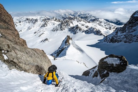 Mountaineer with ice axe and crampons, ascent through steep snowfield to Piz Kesch or Piz d'Es-cha
