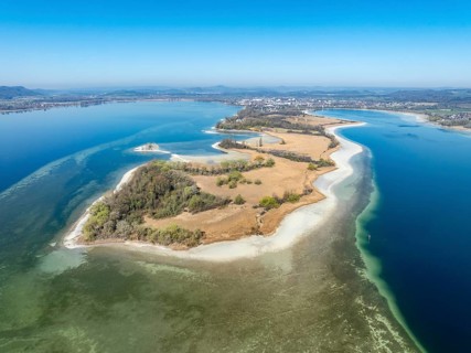 Aerial view of the Mettnau peninsula at low tide with shallows, danger to shipping traffic,