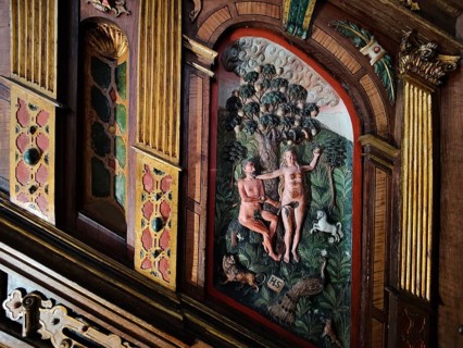 Wood carving of Adam and Eve on the Renaissance pulpit of the Evangelical-Lutheran market church of
