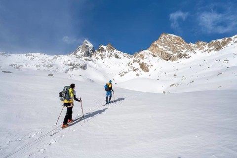 Ski tourers in a wintry mountain landscape, ascent to Porta d'Es-cha, Grisons Haute Route ski tour,