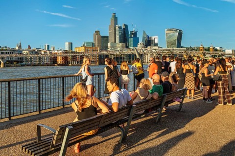 People enjoying the summer evening on the Thames near the Millenium Bridge, London, England, Great