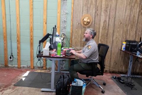Anniston, Alabama - A National Park Service employee works on clerical duties, at the Freedom