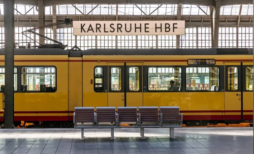Karlsruhe main station, platform with station sign. Tram in the Karlsruhe public transport network