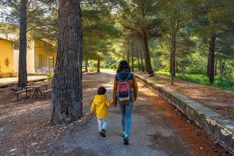 Mother and son enjoying a peaceful walk in the natural setting of the sanctuary of fontcalda in