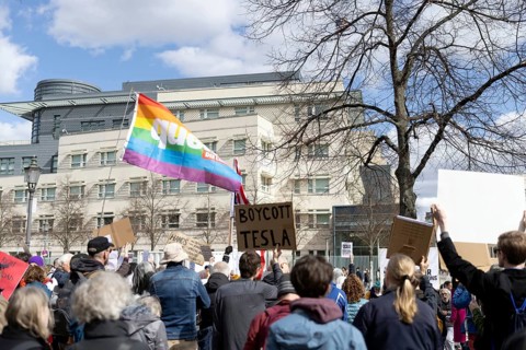 Berlin, Germany - 5 April 2025: A protester holds a sign reading Boycott Tesla as he demonstrates