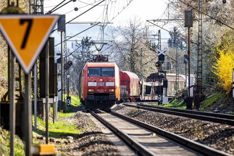 Goods train with a Deutsche Bahn AG locomotive travelling on the open track. Stuttgart,