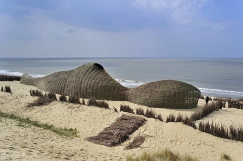 Sandworm by artist Marco Casagrande in the dunes during Beaufort04 at De Haan, Wenduine, Belgium,