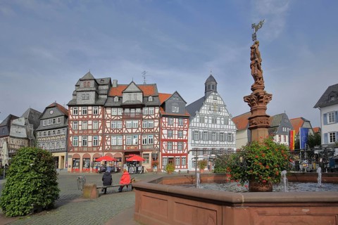 Historic half-timbered houses and market fountain, Haus Zum goldenen Löwen built in 1709 with slate