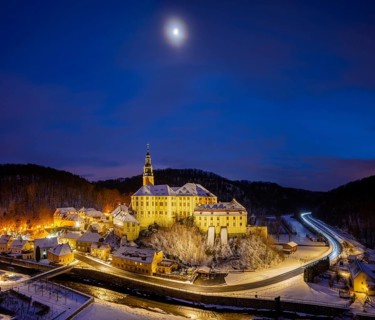 Winter evening in the Müglitz valley, impressively illuminated Weesenstein Castle at the blue hour,
