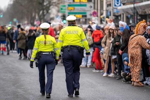 Rose Monday parade in Düsseldorf, police officers on duty at the street carnival, North